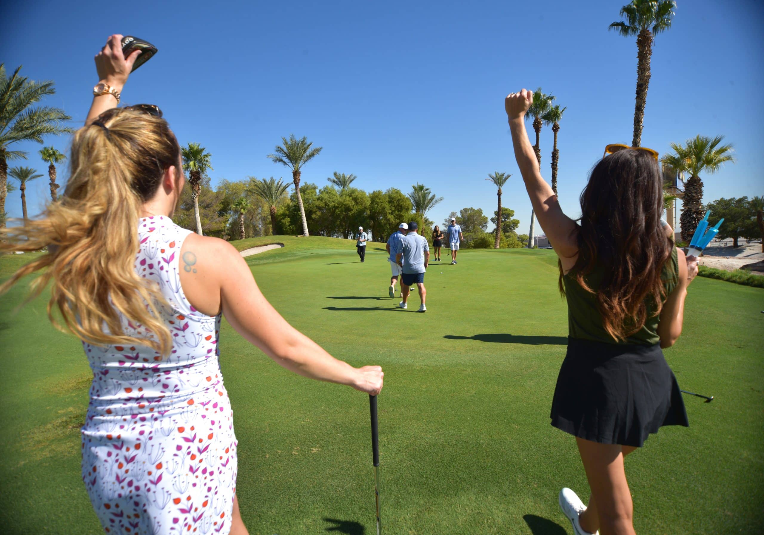 Guests celebrating on the green at Bali Hai Golf Club
